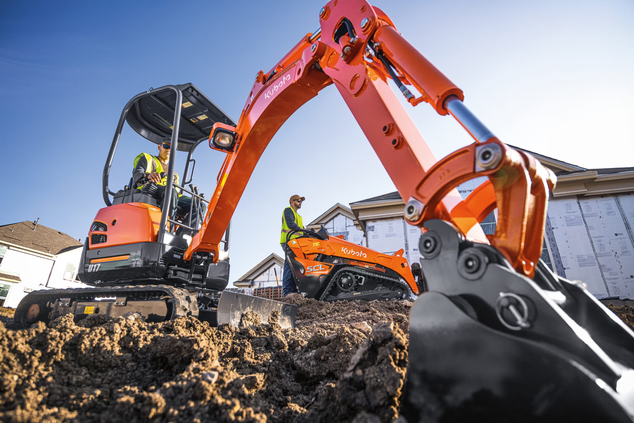 Professional landscaper operating one of the commercial lawn mowers.